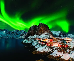 Opening-Spread-Aurora-borealis-over-Hamnoy-in-Norway-By-Piotr-Krzeslak